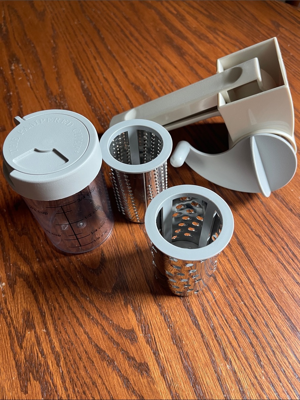 Pampered Chef Handheld Rotary Grater with 2 Stainless Drums & clear container
